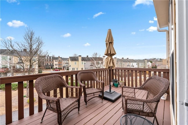 wooden deck with a residential view