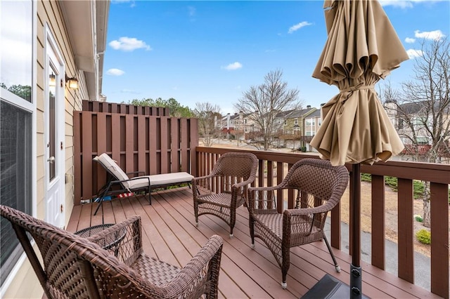 wooden deck with a residential view