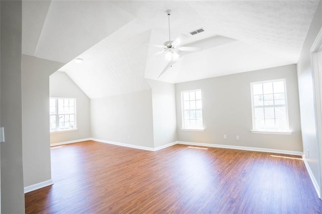 bonus room featuring lofted ceiling, visible vents, and a wealth of natural light