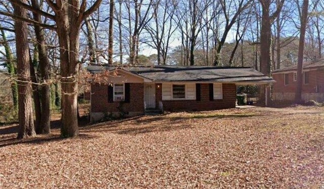 ranch-style home with a carport