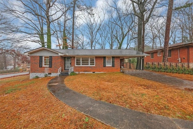 ranch-style home featuring a carport