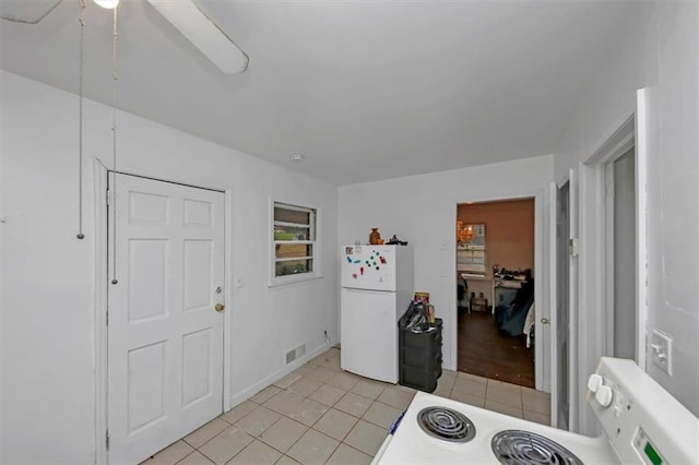 interior space featuring white fridge