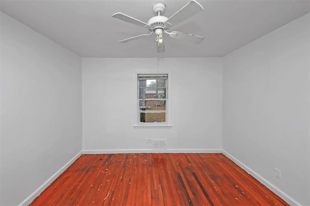 spare room featuring ceiling fan and hardwood / wood-style floors