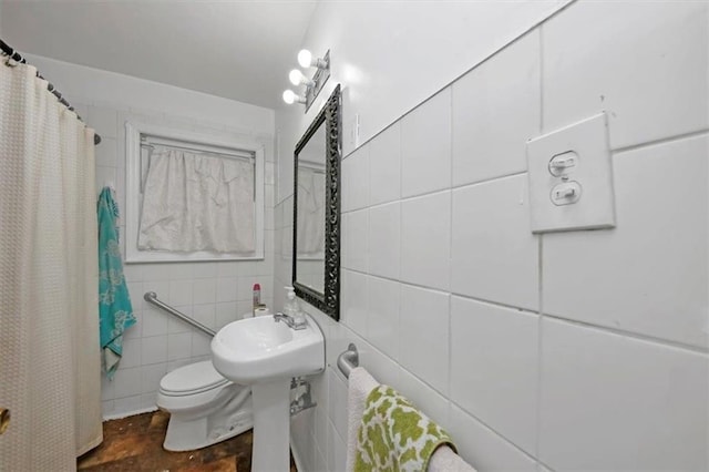 bathroom featuring tile walls, toilet, and a shower with shower curtain