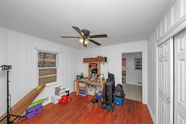 office area featuring dark hardwood / wood-style floors and ceiling fan