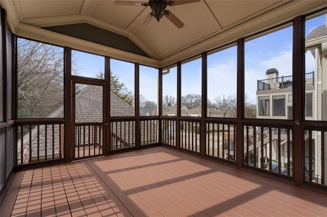 unfurnished sunroom featuring vaulted ceiling and ceiling fan