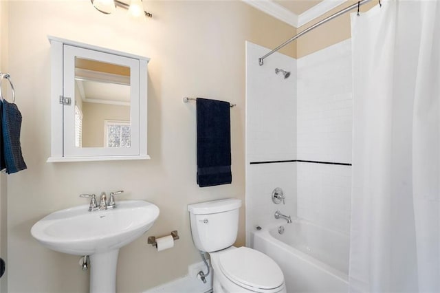 full bathroom with ornamental molding, toilet, sink, and shower / bath combo with shower curtain