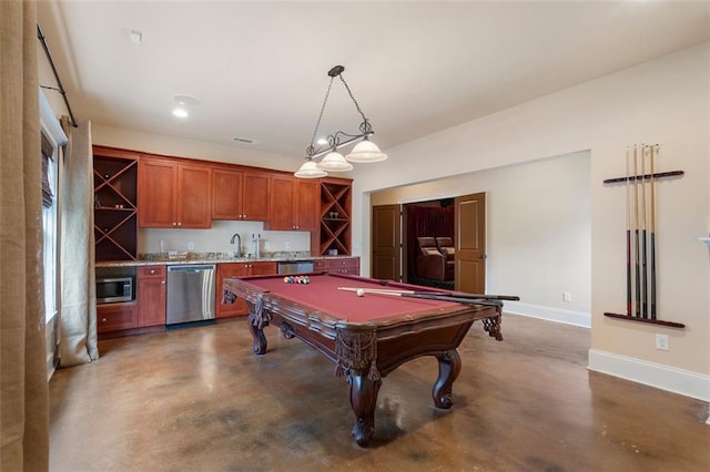 game room featuring indoor wet bar, pool table, and concrete floors