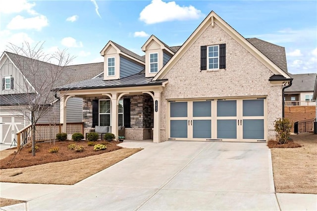 view of front of home featuring a garage and a porch