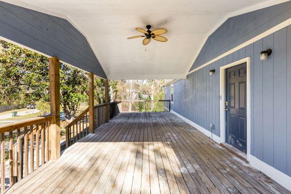 wooden deck featuring ceiling fan