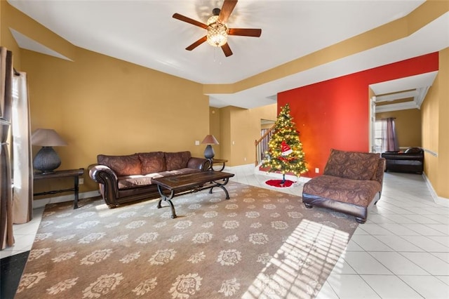 tiled living room featuring ceiling fan