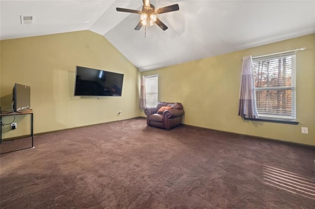 unfurnished room with ceiling fan, lofted ceiling, and dark colored carpet