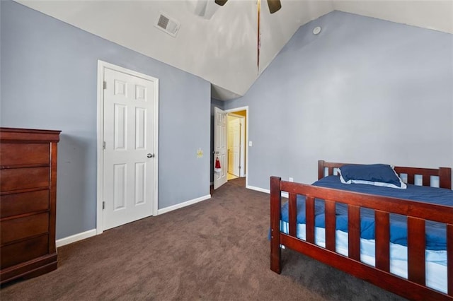 bedroom featuring dark carpet, vaulted ceiling, and ceiling fan