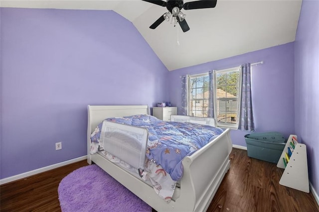 bedroom featuring ceiling fan, dark hardwood / wood-style floors, and vaulted ceiling