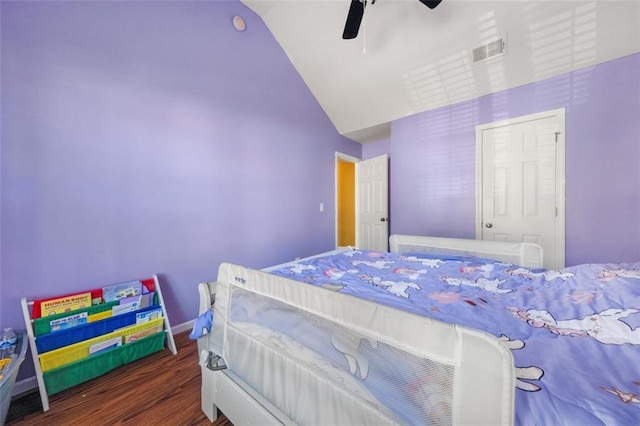 bedroom with ceiling fan, dark hardwood / wood-style flooring, and vaulted ceiling