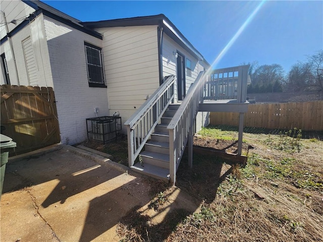 view of side of home with cooling unit