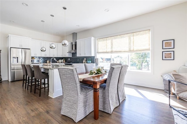 dining area featuring dark hardwood / wood-style floors