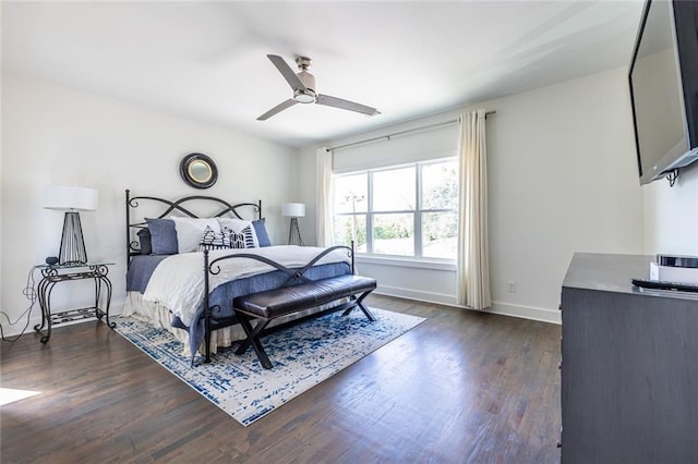 bedroom featuring dark wood-type flooring and ceiling fan