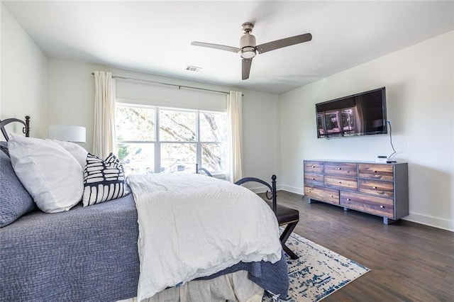 bedroom featuring dark hardwood / wood-style flooring and ceiling fan