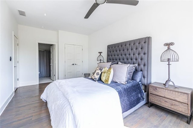 bedroom with dark hardwood / wood-style floors and ceiling fan