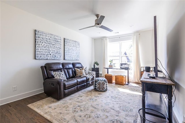 living room with ceiling fan and dark hardwood / wood-style flooring