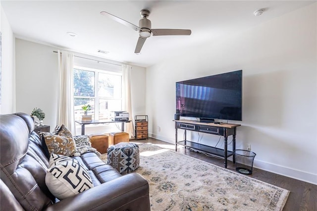 living room with ceiling fan and dark hardwood / wood-style floors