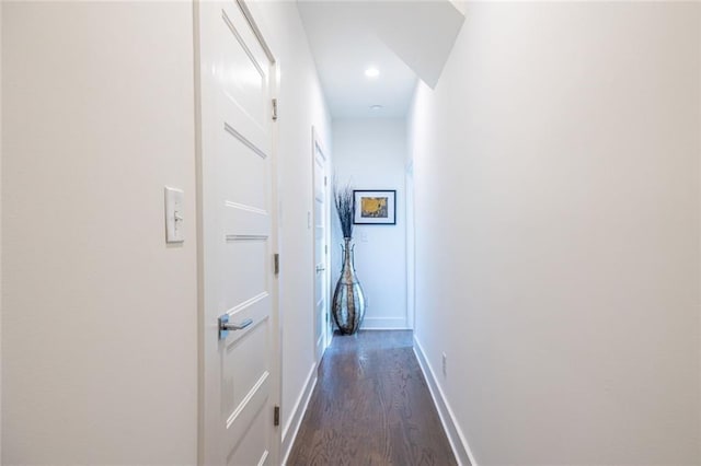 hallway with dark hardwood / wood-style floors