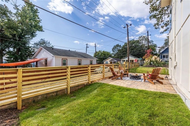 view of yard with a patio area and an outdoor fire pit