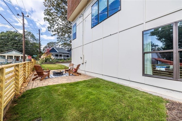 view of yard with a fire pit and a patio area