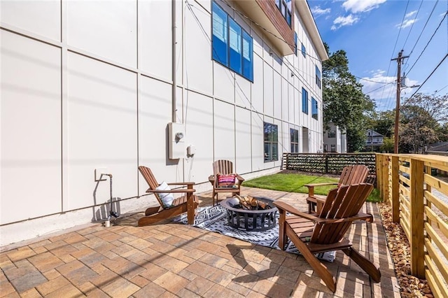 view of patio with an outdoor fire pit