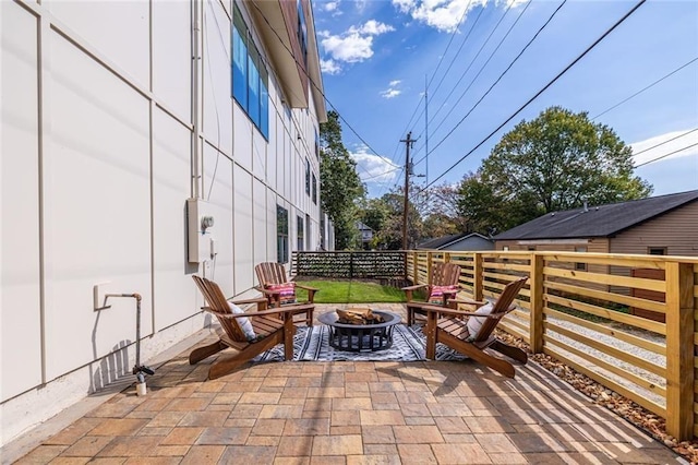 view of patio / terrace featuring a fire pit