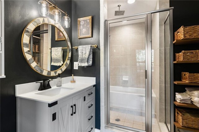 full bath featuring vanity and a stall shower