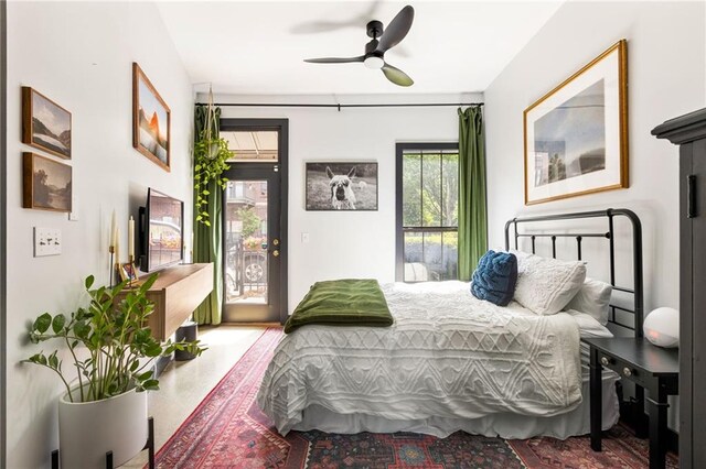 bedroom with a ceiling fan and access to exterior