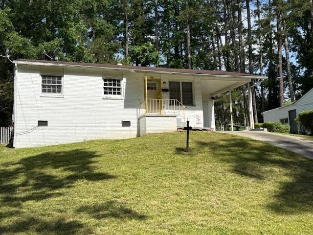 782 Alfred Rd NW, Atlanta, GA 30331 - view of front of property featuring a front yard, concrete driveway, a carport, and crawl space