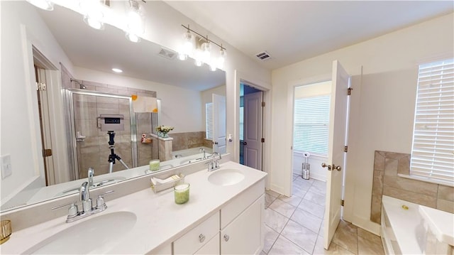 bathroom with vanity, independent shower and bath, and tile patterned flooring