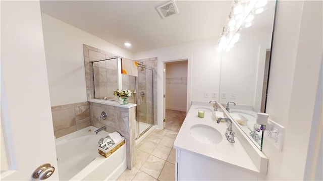 bathroom featuring tile patterned flooring, separate shower and tub, and vanity