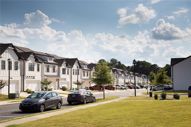 view of street with a residential view, sidewalks, and street lighting