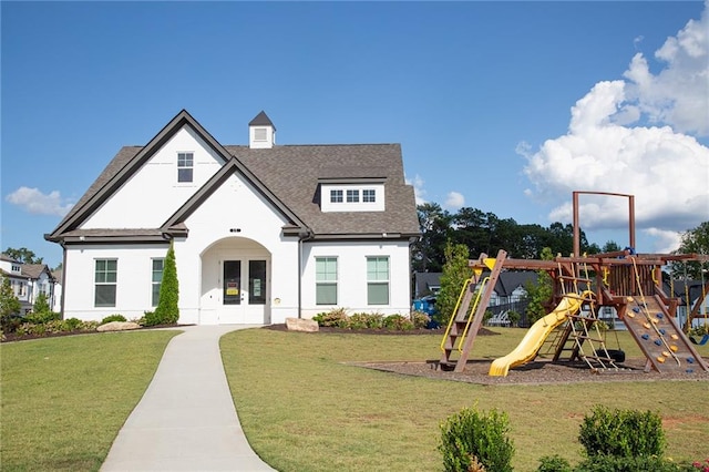 exterior space featuring a lawn and french doors