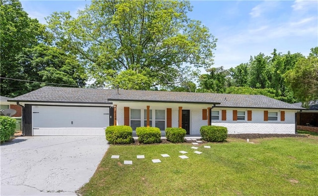 2159 Fairburn Rd SW, Atlanta, GA 30331 - single story home with a front lawn, driveway, brick siding, an attached garage, and covered porch