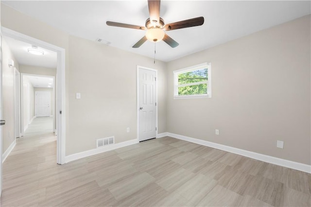 2159 Fairburn Rd SW, Atlanta, GA 30331 - unfurnished bedroom featuring light wood-style flooring, baseboards, and a ceiling fan