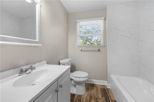 2159 Fairburn Rd SW, Atlanta, GA 30331 - bathroom featuring toilet, wood tiled floors, vanity, and baseboards