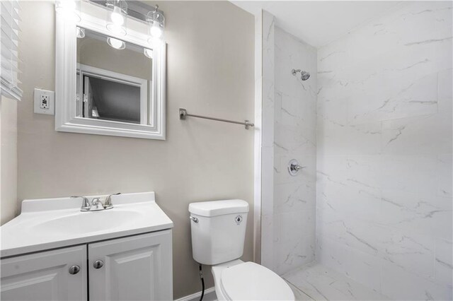 2159 Fairburn Rd SW, Atlanta, GA 30331 - bathroom featuring vanity, toilet, and a marble finish shower