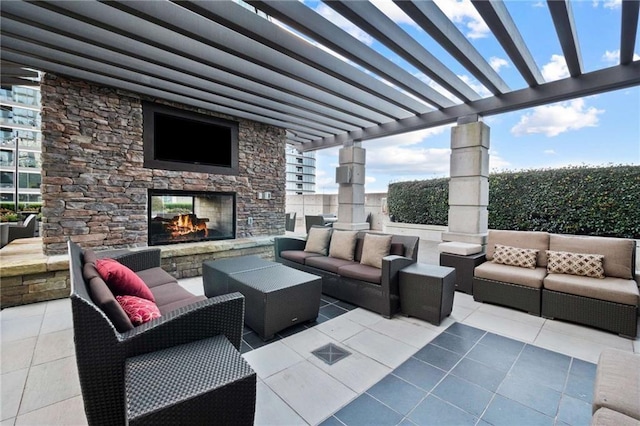 view of patio with an outdoor living space with a fireplace and a pergola