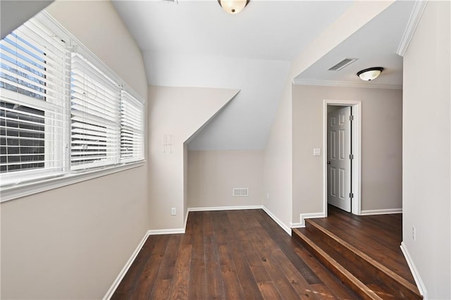 bonus room with dark hardwood / wood-style flooring and vaulted ceiling