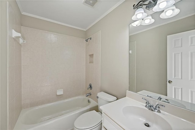 full bathroom with crown molding, vanity, tiled shower / bath combo, and toilet