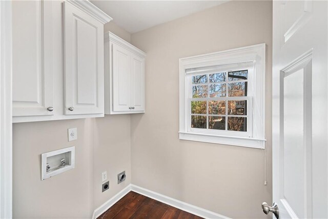 washroom with washer hookup, cabinets, dark hardwood / wood-style floors, and hookup for an electric dryer