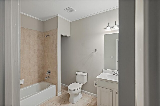 full bathroom with vanity, crown molding, tile patterned flooring, toilet, and tiled shower / bath