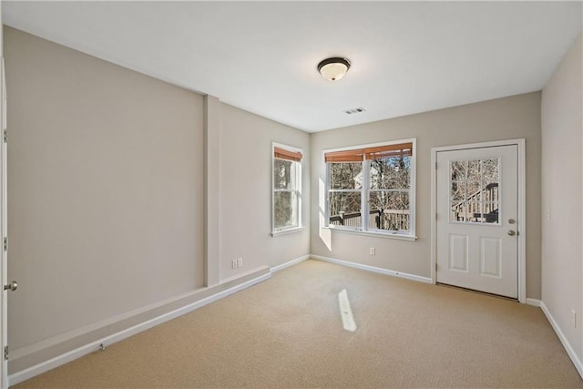 empty room with light colored carpet