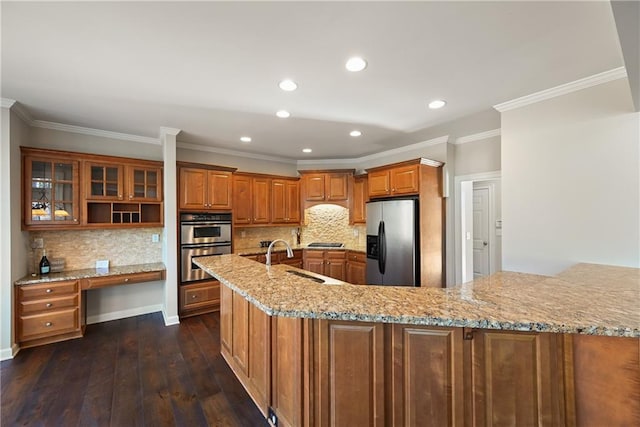 kitchen featuring backsplash, dark hardwood / wood-style floors, sink, and stainless steel appliances