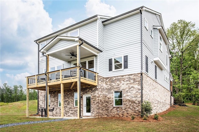 7505 Woolf Way, Cumming, GA 30028 - rear view of property featuring a ceiling fan, a lawn, brick siding, and a wooden deck